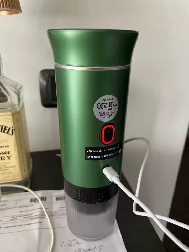 Green electronic device with USB cable on a surface
