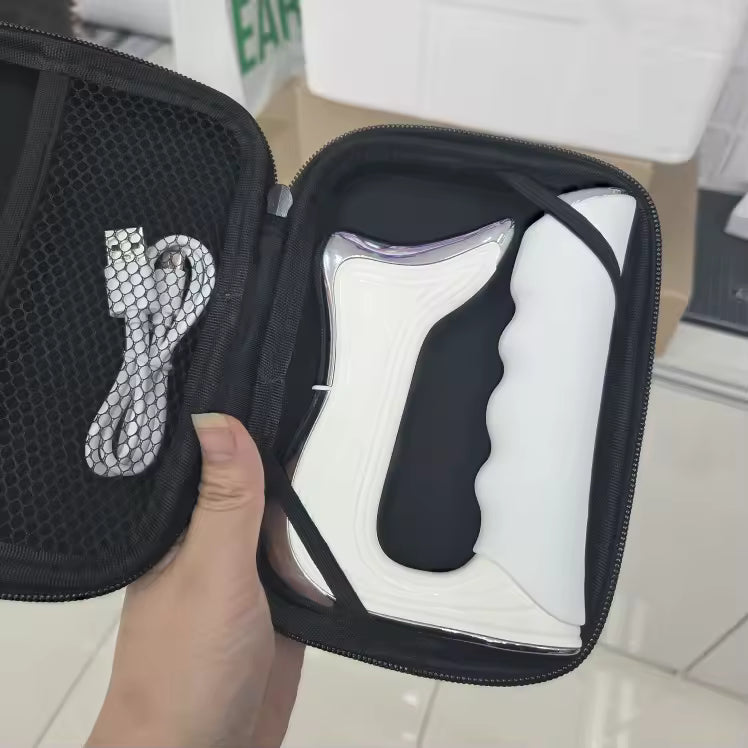 White sneaker with black sole in a black carrying case held by a hand.